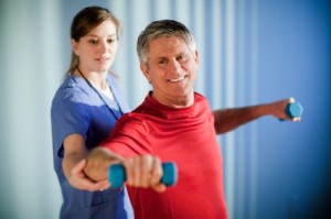 Mature Man Working With a Physical Therapist